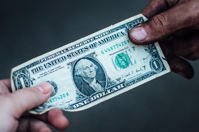 dollar bill giving