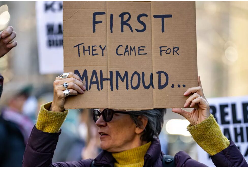 Protestor with sign- First They Came for Mahmoud
